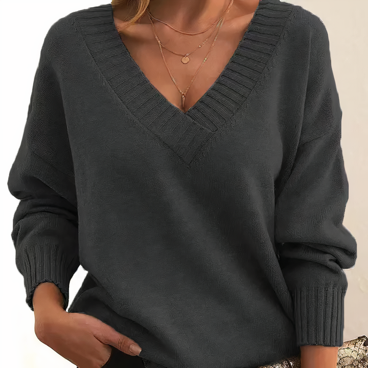 Elegant women's V-neck knit sweater. Isabella cashmere long-sleeve top for chic, versatile everyday wear.