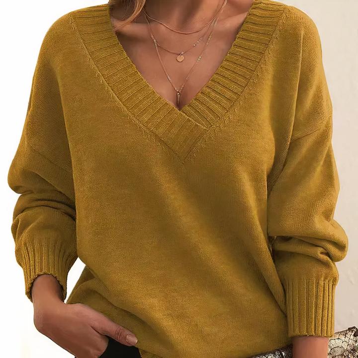 Chic women's V-neck knit sweater. Isabella cashmere long-sleeve top for versatile elegant everyday wear.