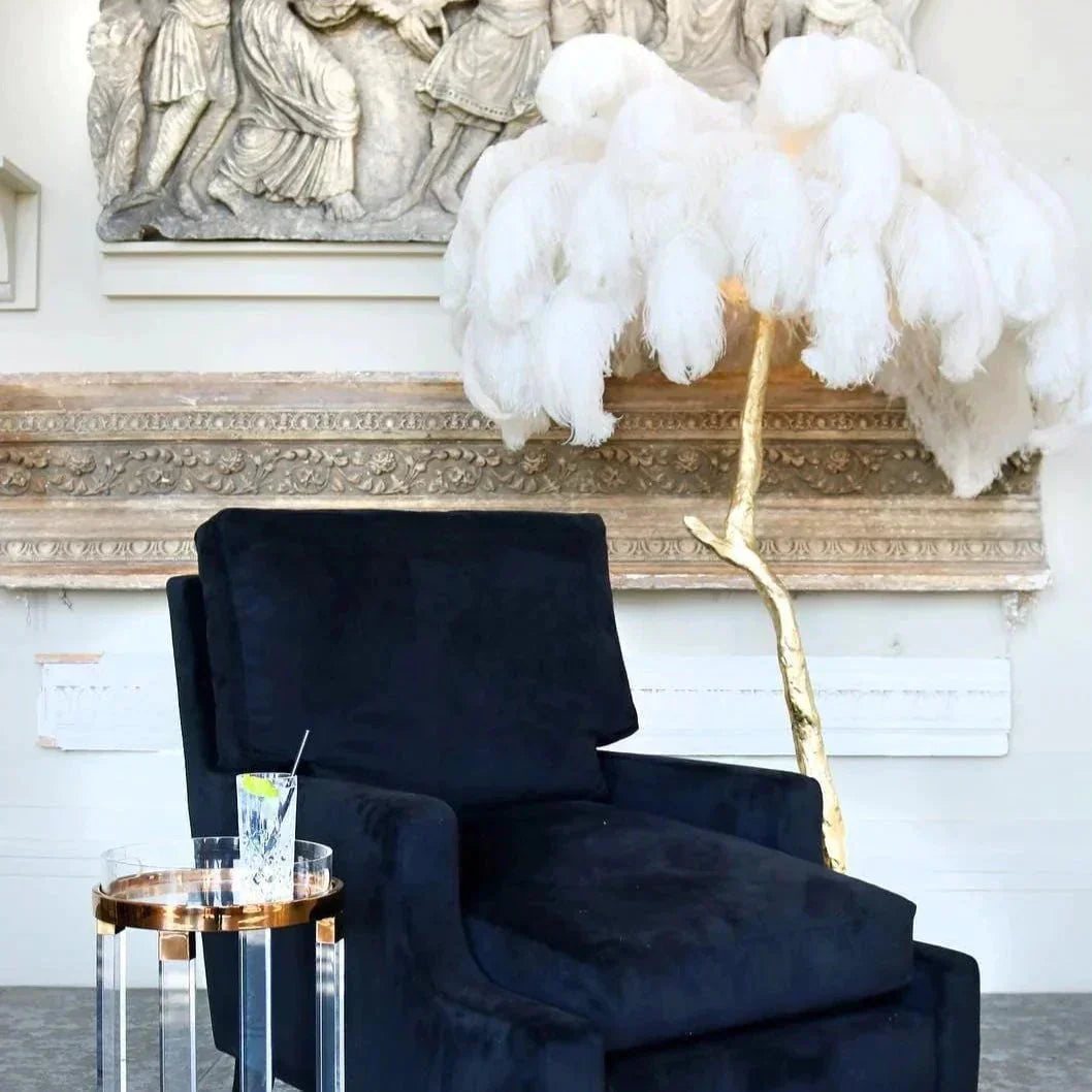 Luxurious Ostrich Feather Floor Lamp with cascading feathers, polished brass finish, and resin base for elegant home lighting