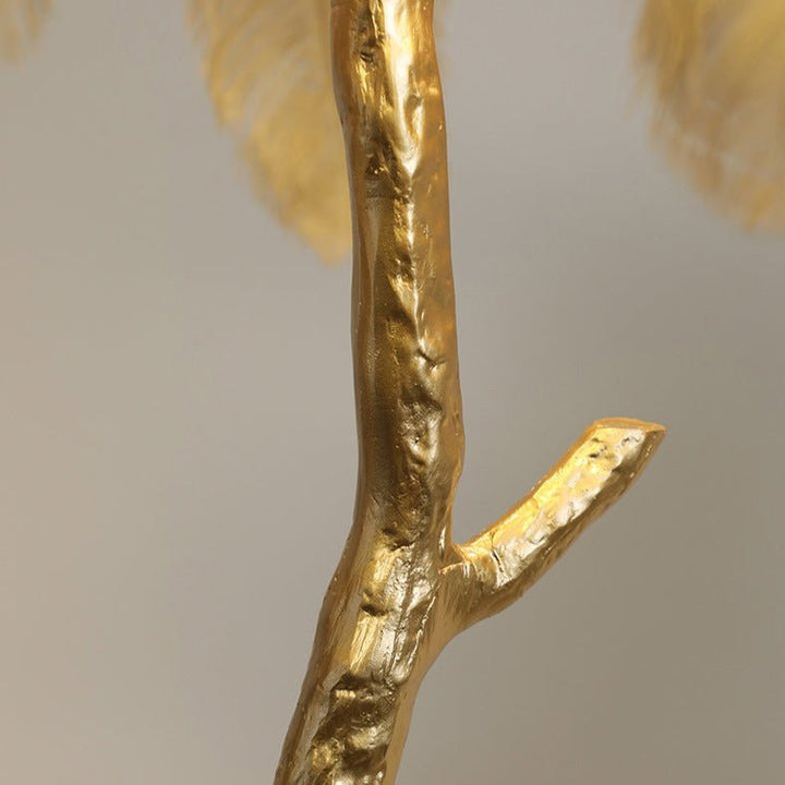 Luxurious Ostrich Feather Floor Lamp with cascading feathers, polished brass finish, and resin base for elegant home lighting