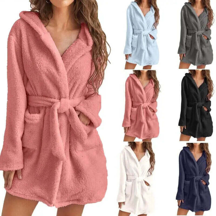 Women's warm plush hooded bathrobe with pockets. Knee-length cozy fleece for ultimate comfort.