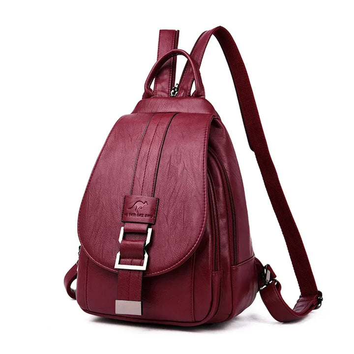 Organized anti-theft women's leather backpack interior, secure pockets for travel essentials.