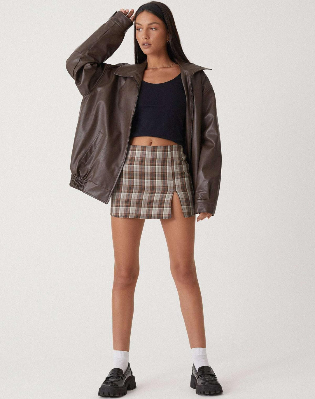 Luxurious women's oversized chocolate brown leather jacket, a stylish essential for fall and winter fashion.