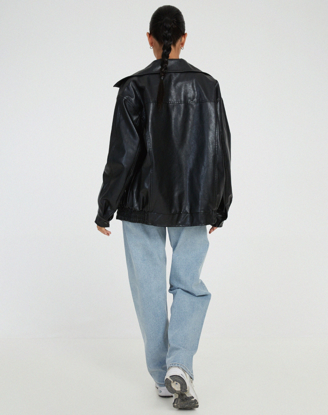 Stylish women's oversized leather jacket in a rich chocolate brown hue, ideal for contemporary fall-winter looks.