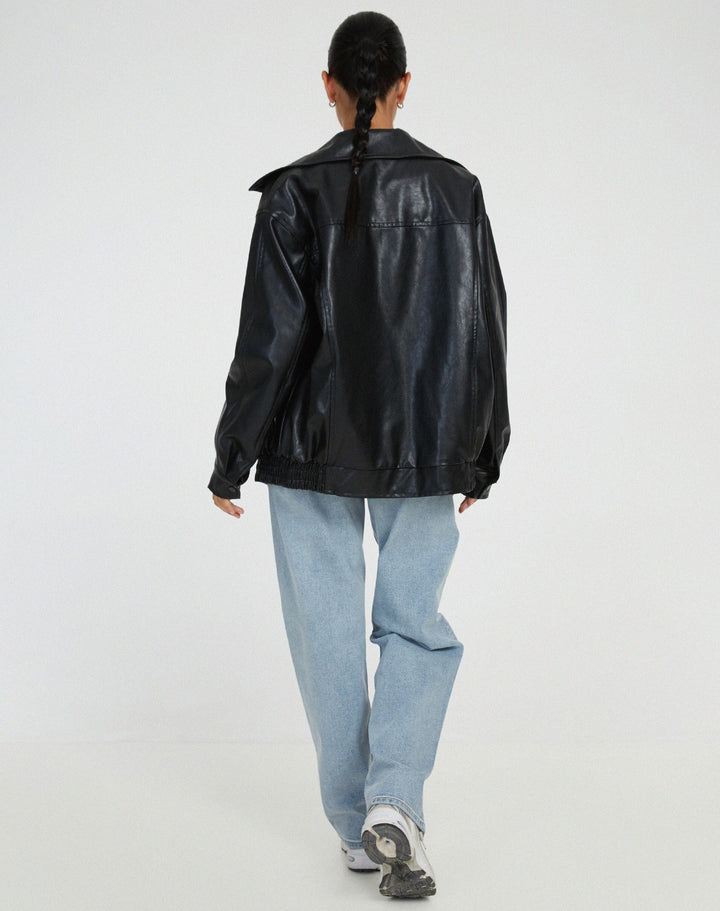 Stylish women's oversized leather jacket in a rich chocolate brown hue, ideal for contemporary fall-winter looks.