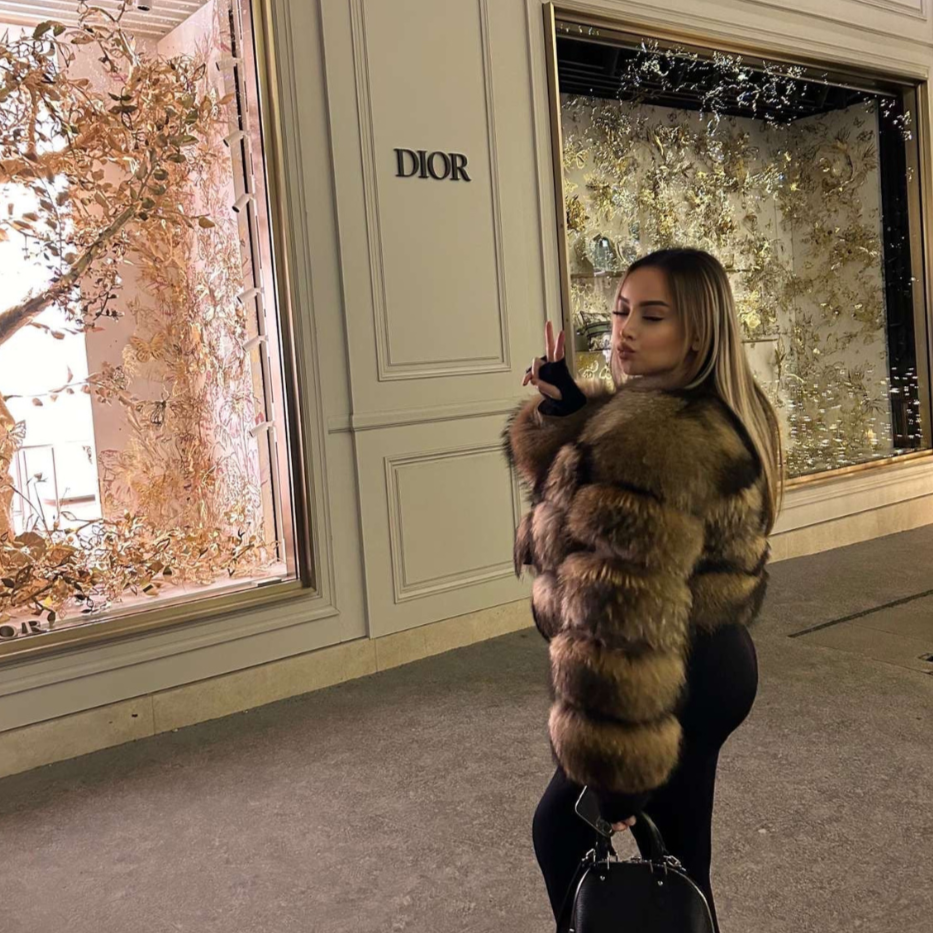 Elegant black women's plush winter jacket, a warm and fashionable outerwear piece for luxury style.