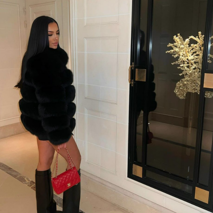 Soft plush women's winter jacket, a luxurious and warm outerwear choice for chic cold-weather fashion.
