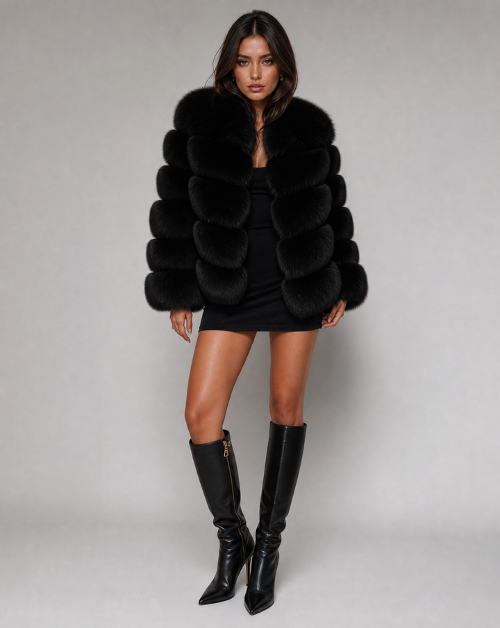 Stylish women's plush winter jacket, perfect warm outerwear for cold weather, offering a luxurious chic look.