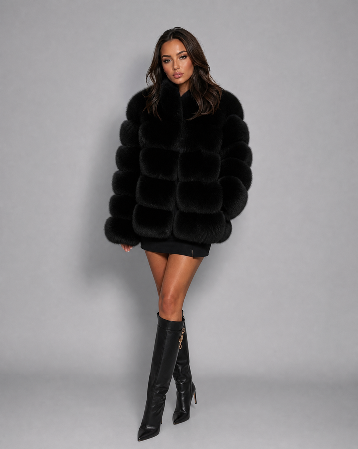 Elegant women's plush winter jacket, a sophisticated and warm outerwear choice for luxurious cold-weather style.