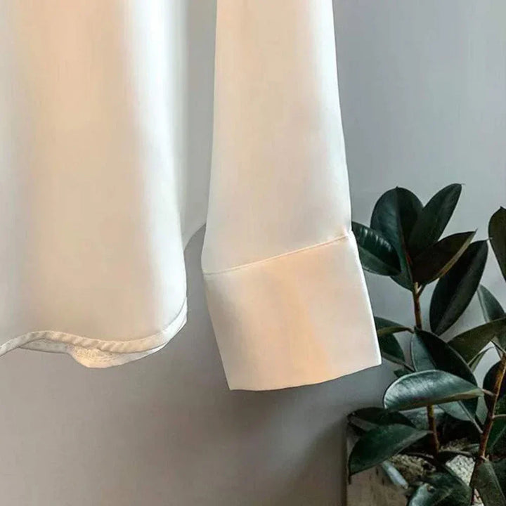 Fashionable women's silk fall blouse. Classic long-sleeve top, elegant for workwear, office, or luxury apparel.