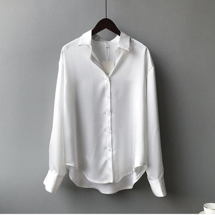 Versatile women's silk blouse for fall fashion. Classic long-sleeve luxury apparel, great for office wear.