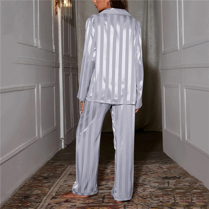 Front view of a women's silk-feel pyjama set, showcasing its elegant button-down design.