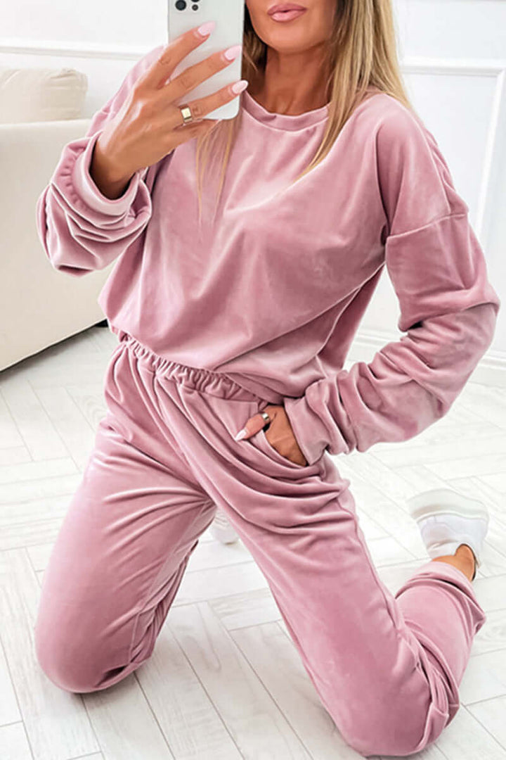 Elegant women's velvet lounge set, a versatile two-piece for luxurious comfort or chic home wear.