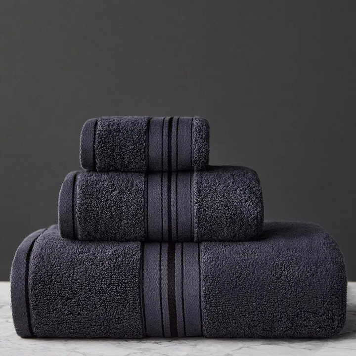 Neatly folded luxury Egyptian cotton bath towel set, ideal for elegant bathroom decor & essential daily use.