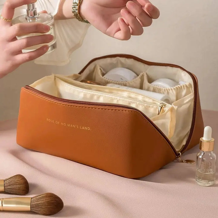 Convenient luxury travel toiletry bag with zipper, perfect for women's beauty needs.
