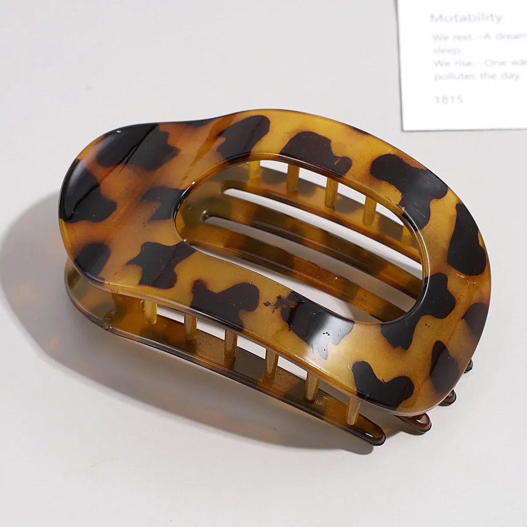 Women's secure hold hair clip, matte oval flat duckbill style for reliable grip.