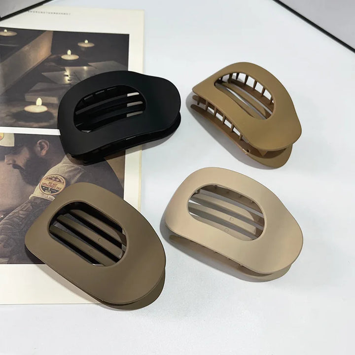 Fashionable matte duckbill hair clip, perfect for a minimalist bun or updo.