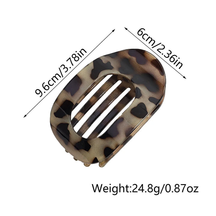 Women's oval matte hair claw, a chic hair accessory for daily elegant wear.