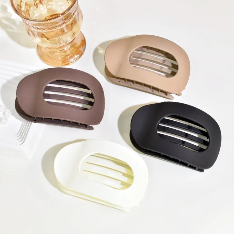 Stylish women's matte duckbill hair clip for a neat hair bun or half-up style.