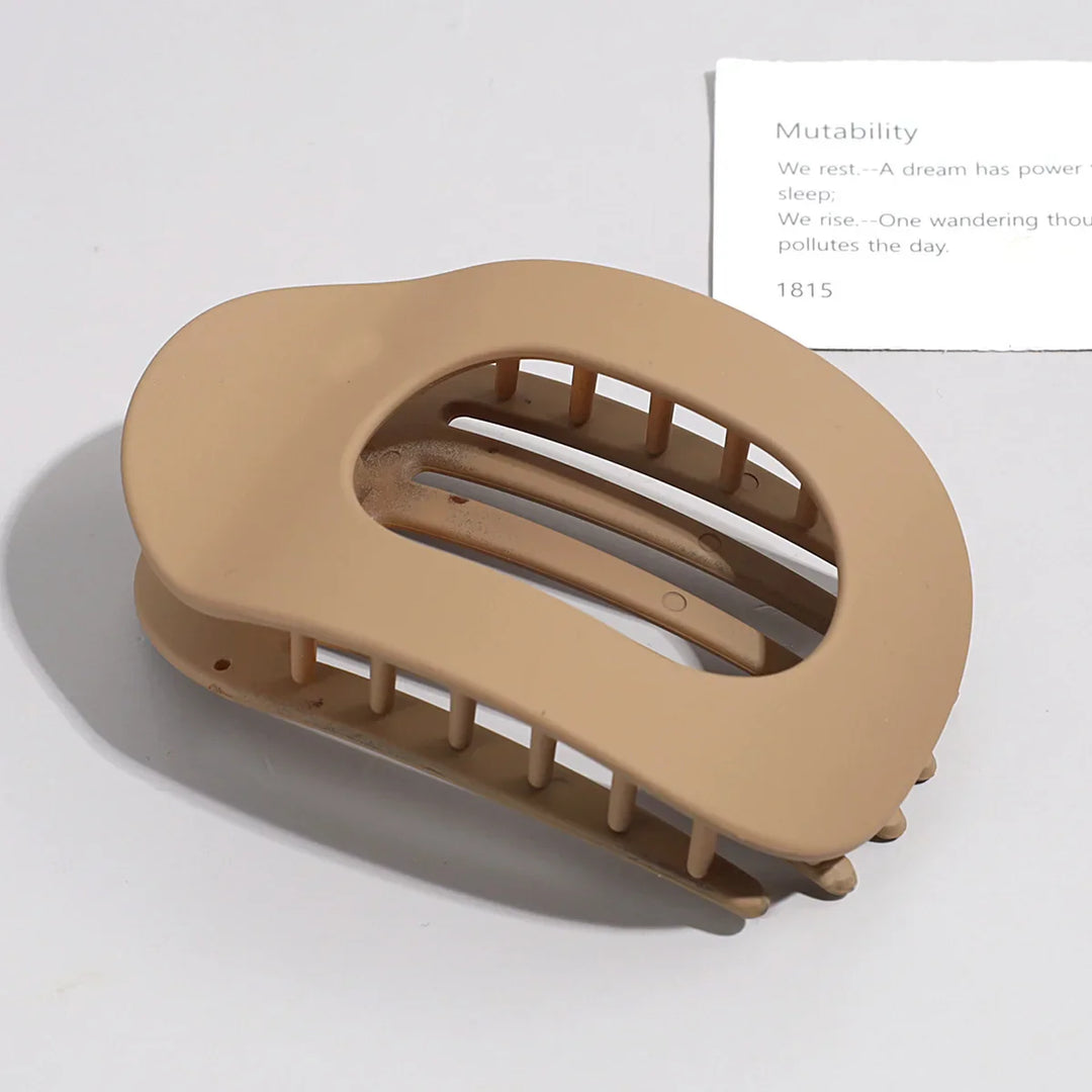 Women's minimalist matte flat hair claw clip, secure and stylish hair accessory.