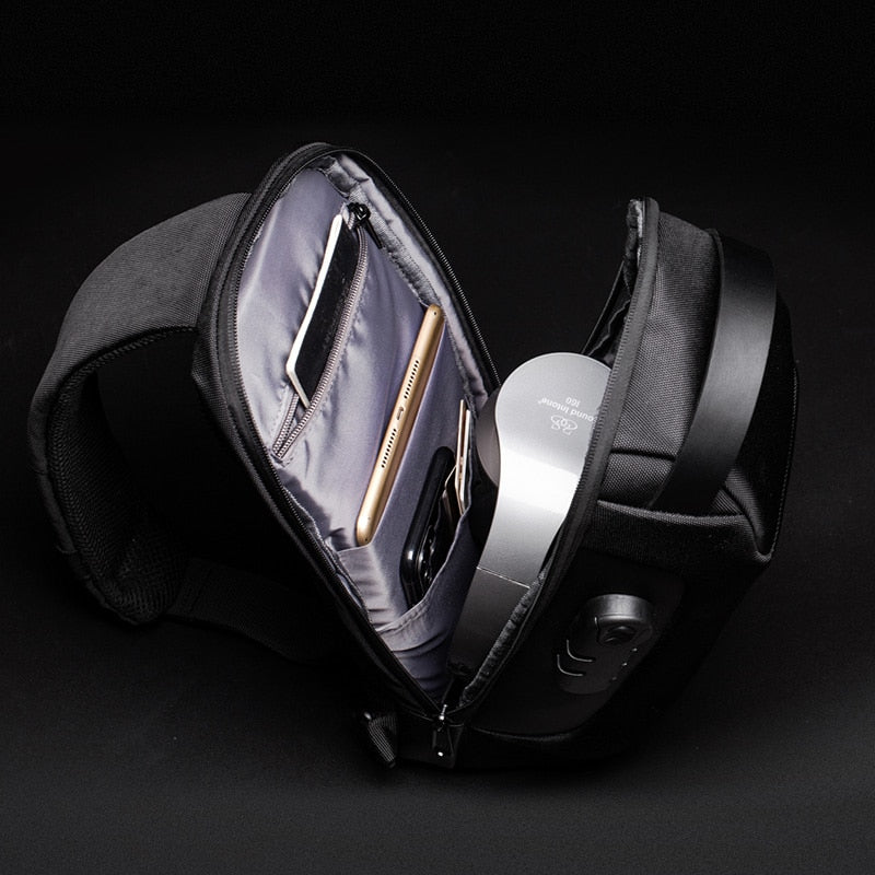 Modern men's compact crossbody bag with anti-theft features, water resistance, and built-in USB charging.