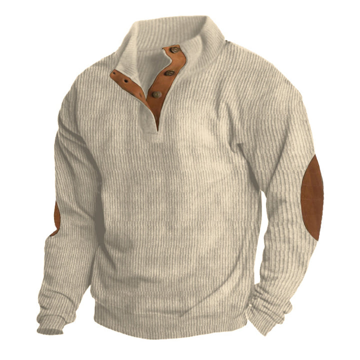 Man hiking in mountains wearing Asher outdoor sweater. Stylish, warm, versatile pullover for adventure & comfort.