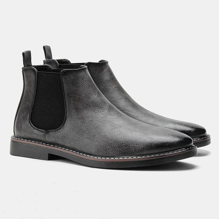 Durable men's leather Chelsea boots. Reliable slip-on ankle footwear, offering comfort and versatility for daily wear.