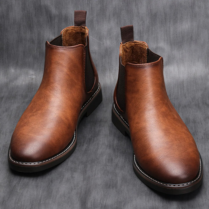 Classic leather men's Chelsea boots. Comfortable slip-on ankle footwear, perfect for versatile styling.