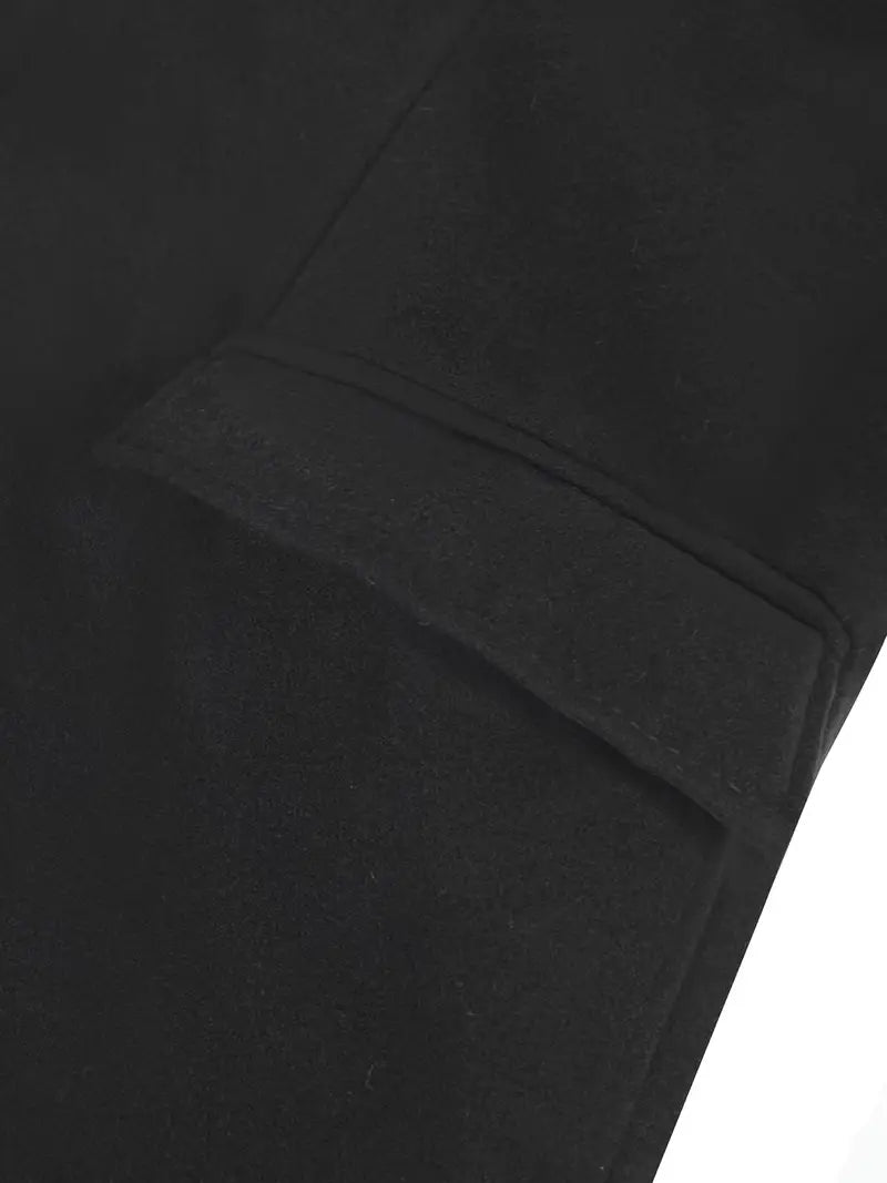 Black men's slim fit trench coat with a prominent notched lapel. Long, elegant outerwear for sophisticated winter fashion.