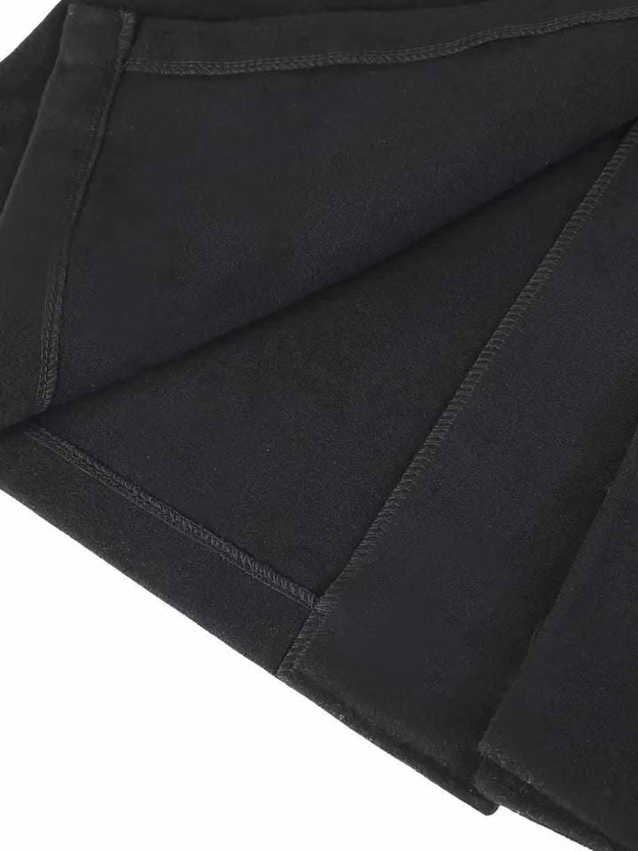 Black slim fit men's long trench coat. Notched lapel, elegant outerwear for business casual and winter men's style.
