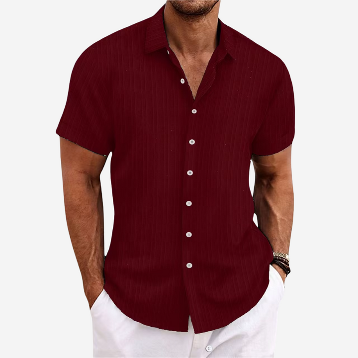 Men's fashion summer button-up shirt with short sleeves, offering a comfortable and versatile look.
