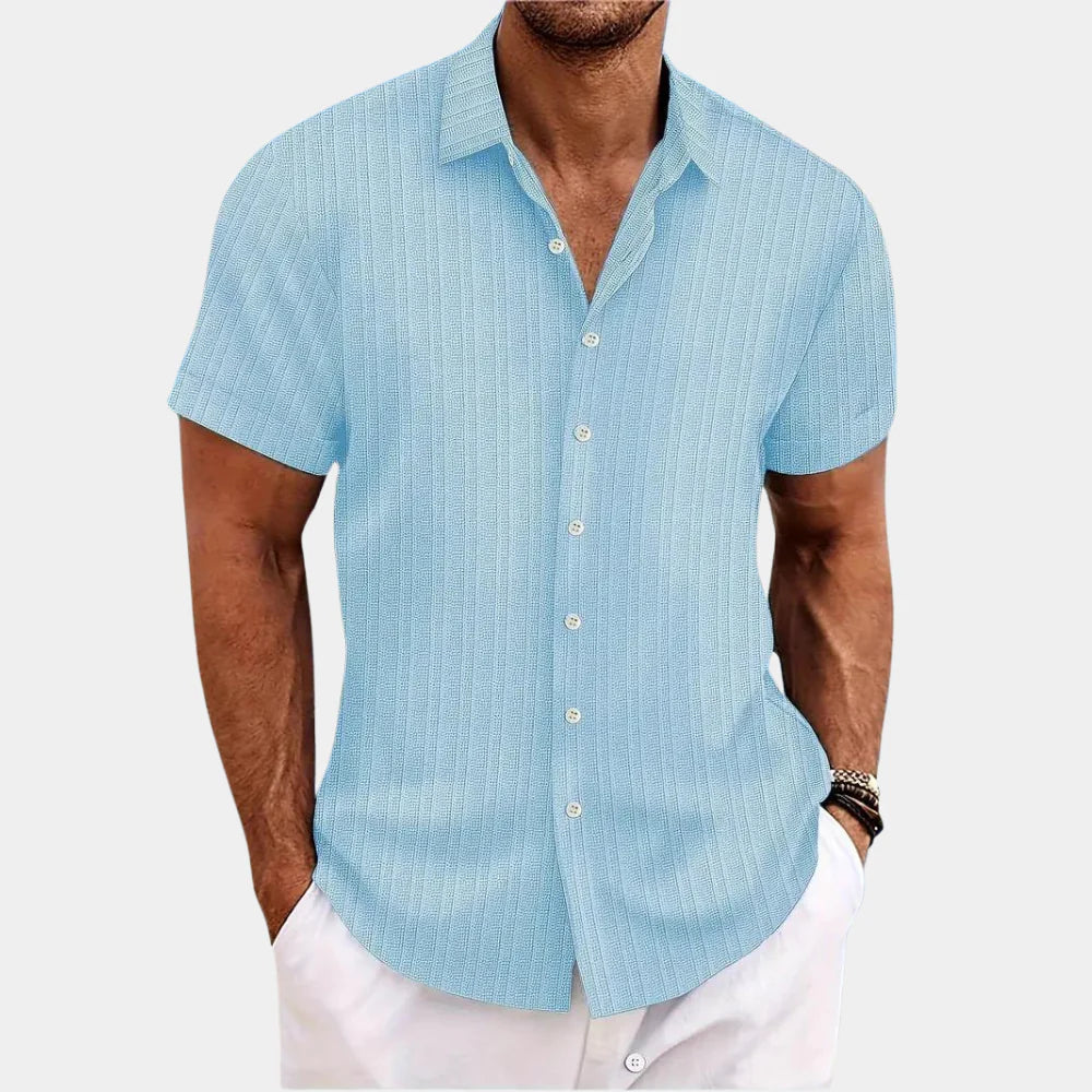 Side view of a man wearing a stylish, breathable short-sleeve button-up summer shirt.