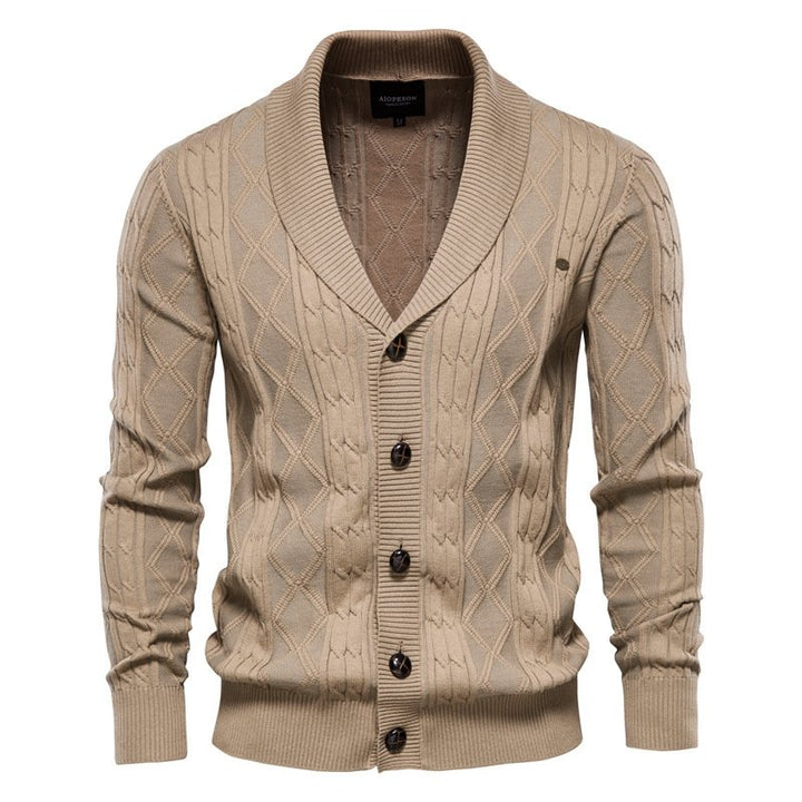 Well-tailored men's cable knit V-neck cardigan with a prominent shawl collar, ideal layering piece.