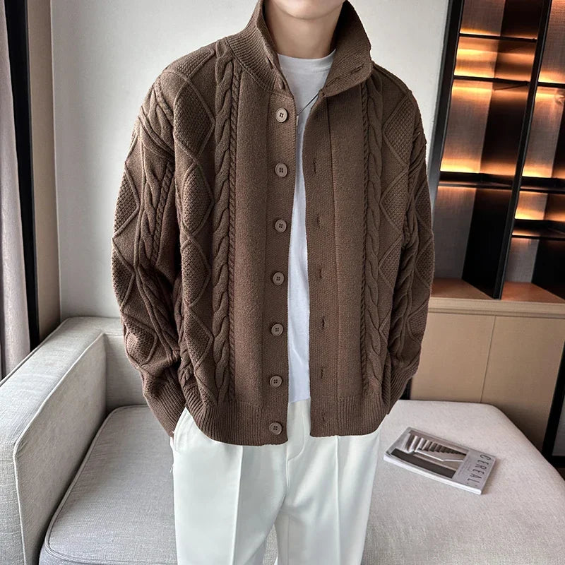 Cozy men's cable knit button-up cardigan, featuring a warm texture for comfortable winter wear and layering.
