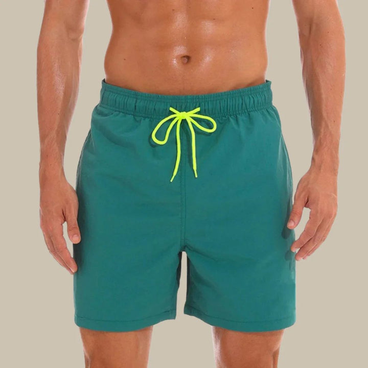 Comfortable men's summer shorts for swimming & casual wear. Features a drawstring closure & pockets.