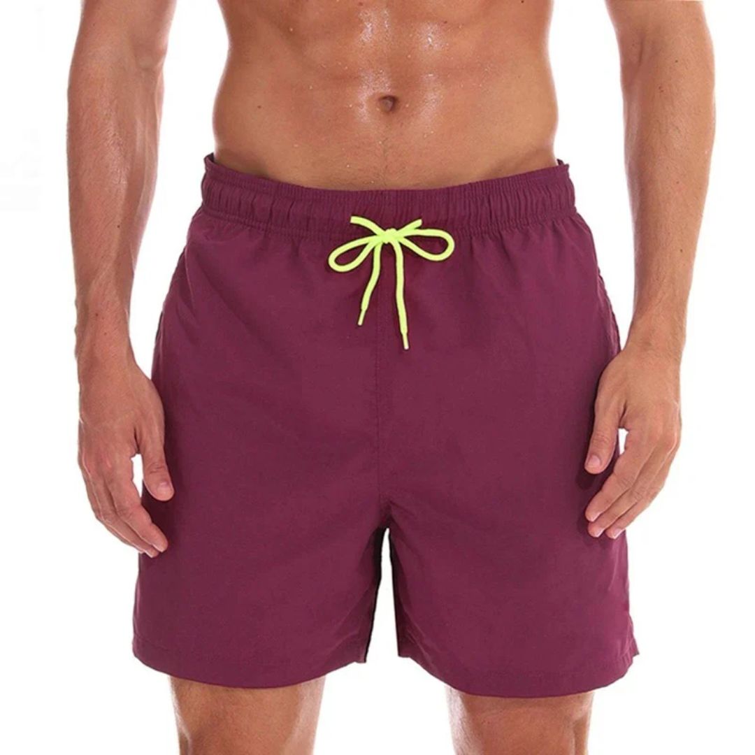 Versatile men's casual swim shorts: quick-dry fabric, drawstring, side pockets. Great for summer beach trips.