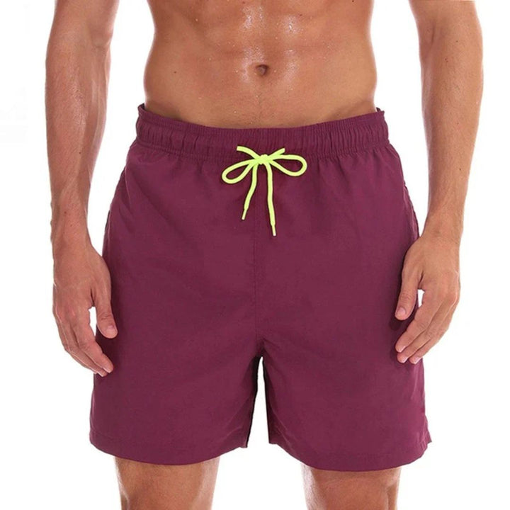Versatile men's casual swim shorts: quick-dry fabric, drawstring, side pockets. Great for summer beach trips.