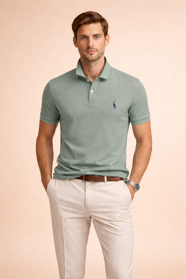 Detail shot of a men's collared, short-sleeve polo shirt, emphasizing the tailored fit and classic design.