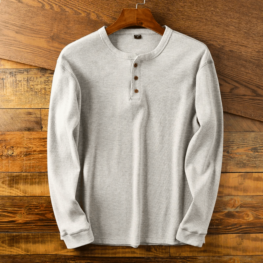 Men's comfort-fit long-sleeve henley shirt in soft fabric for everyday casual style.