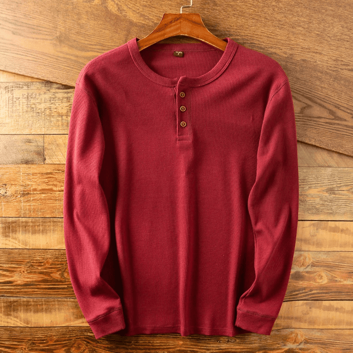 Stylish men's henley shirt with three-button placket, perfect for casual comfort and versatile wear.