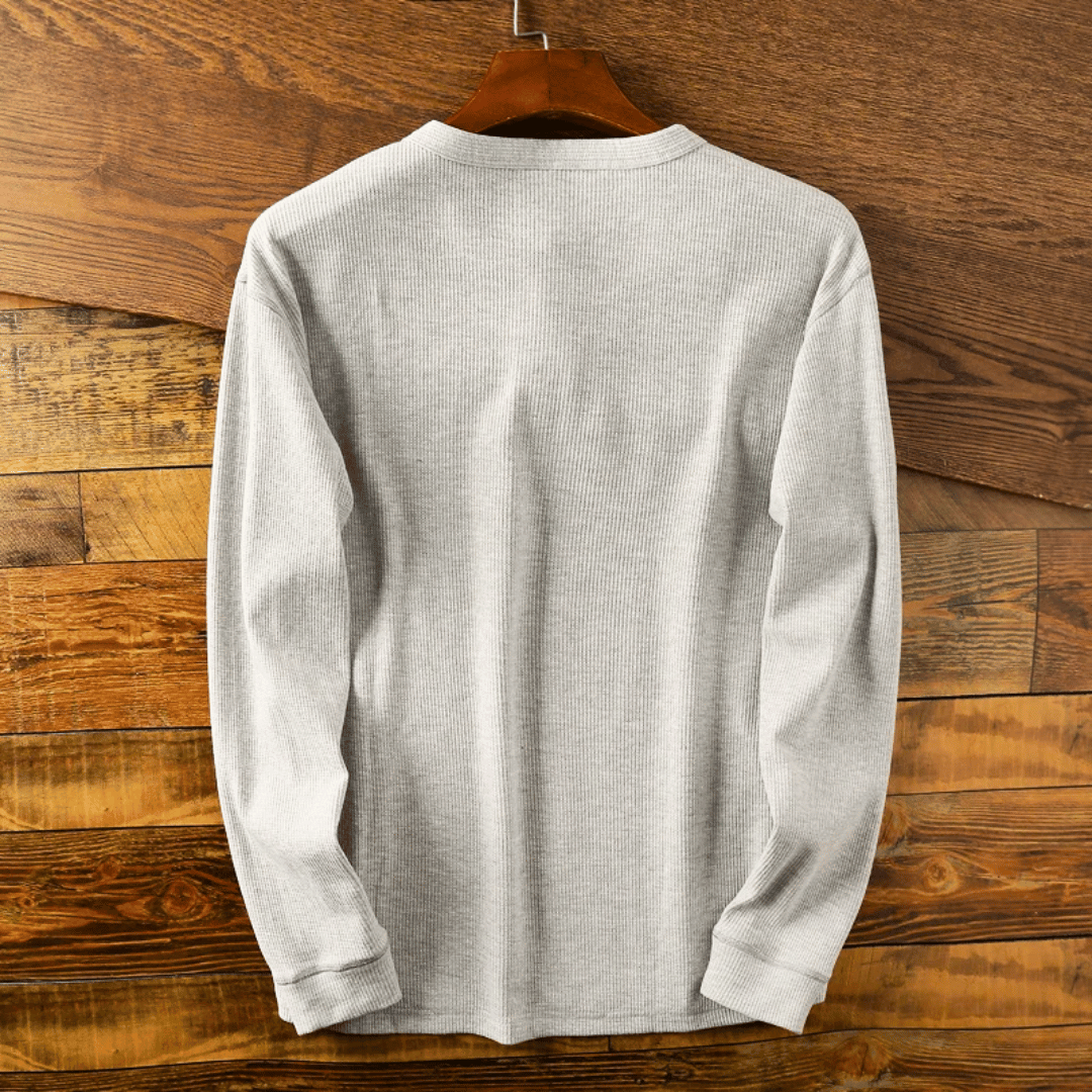 Men's casual henley shirt featuring a button placket and long sleeves for everyday comfort and style.