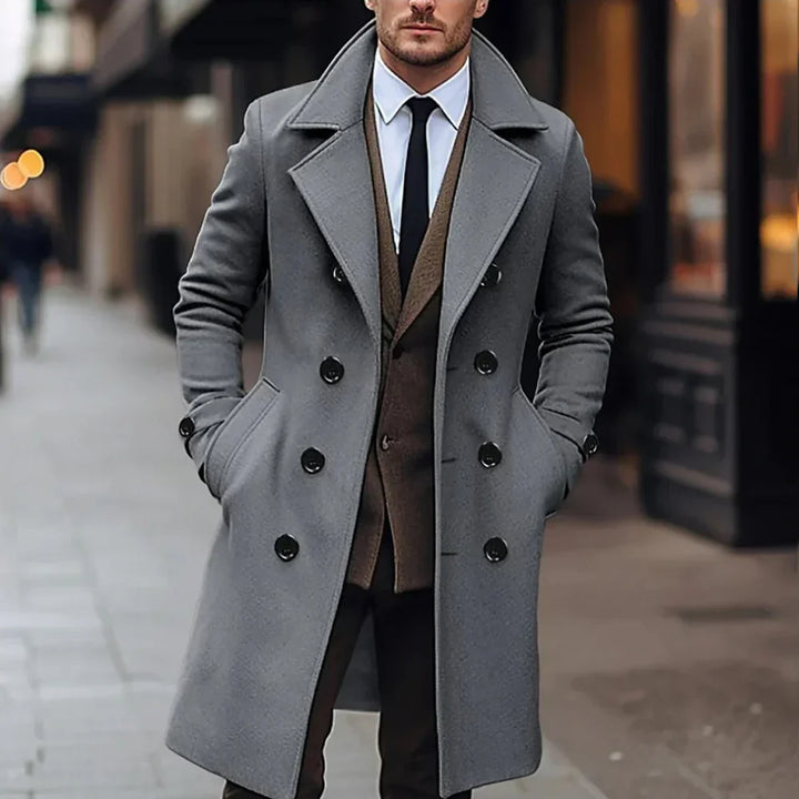 Professional men's dark gray tailored coat. Elegant fall/winter outerwear for sophisticated formal style.