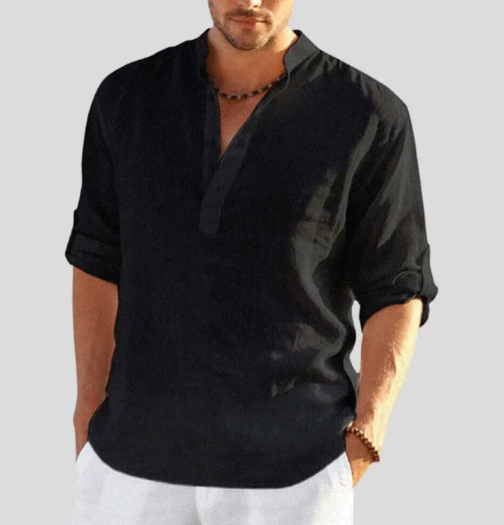 Man wearing a stylish Hugo Luxe linen button-down shirt. Elegant long-sleeve for spring or summer comfort.