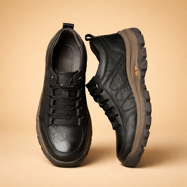 Black men's hand-stitched comfort shoes, designed for support & daily wear. Durable casual footwear with ergonomic design.