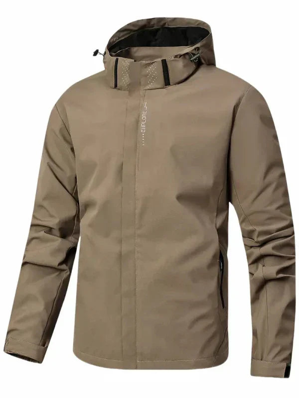 Men's activewear rain jacket modeled outdoors, showcasing its comfortable fit & weatherproof features.