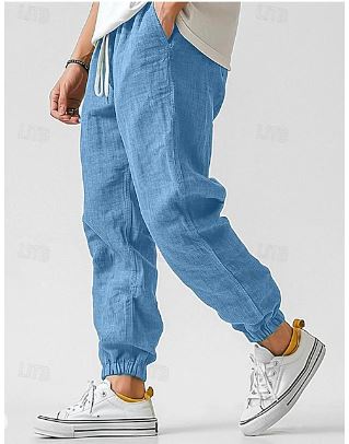 Close-up of men's lightweight cargo pants, highlighting the comfortable drawstring waist & practical pockets.