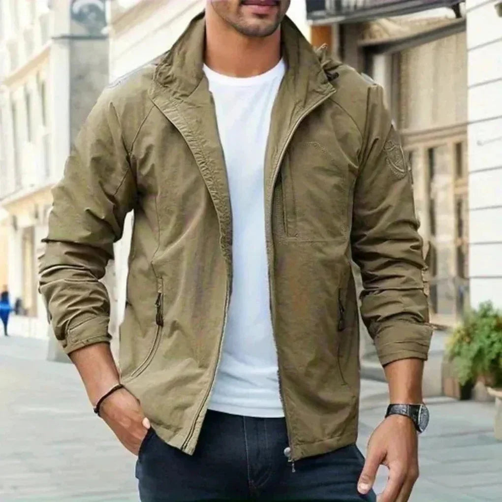 Men's lightweight transitional jacket in a relaxed fit, perfect for spring/fall outerwear. Water-resistant zip-up style.