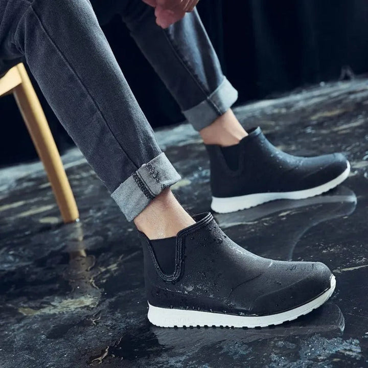 Men's lightweight waterproof slip-on rain boots, ideal for wet weather, gardening & work. All-day comfort.