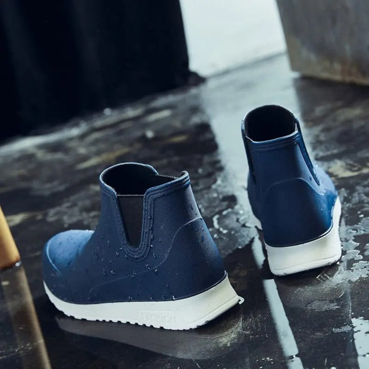 Durable men's mid-calf slip-on rain boots, waterproof & comfortable for gardening or outdoor utility.