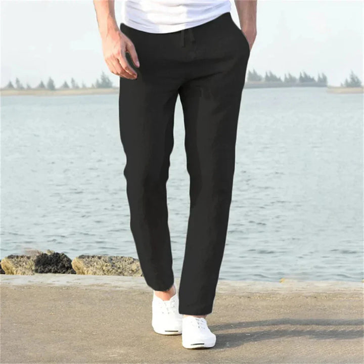 Black men's linen trousers, airy straight leg, breathable for summer casual fashion and warm weather.